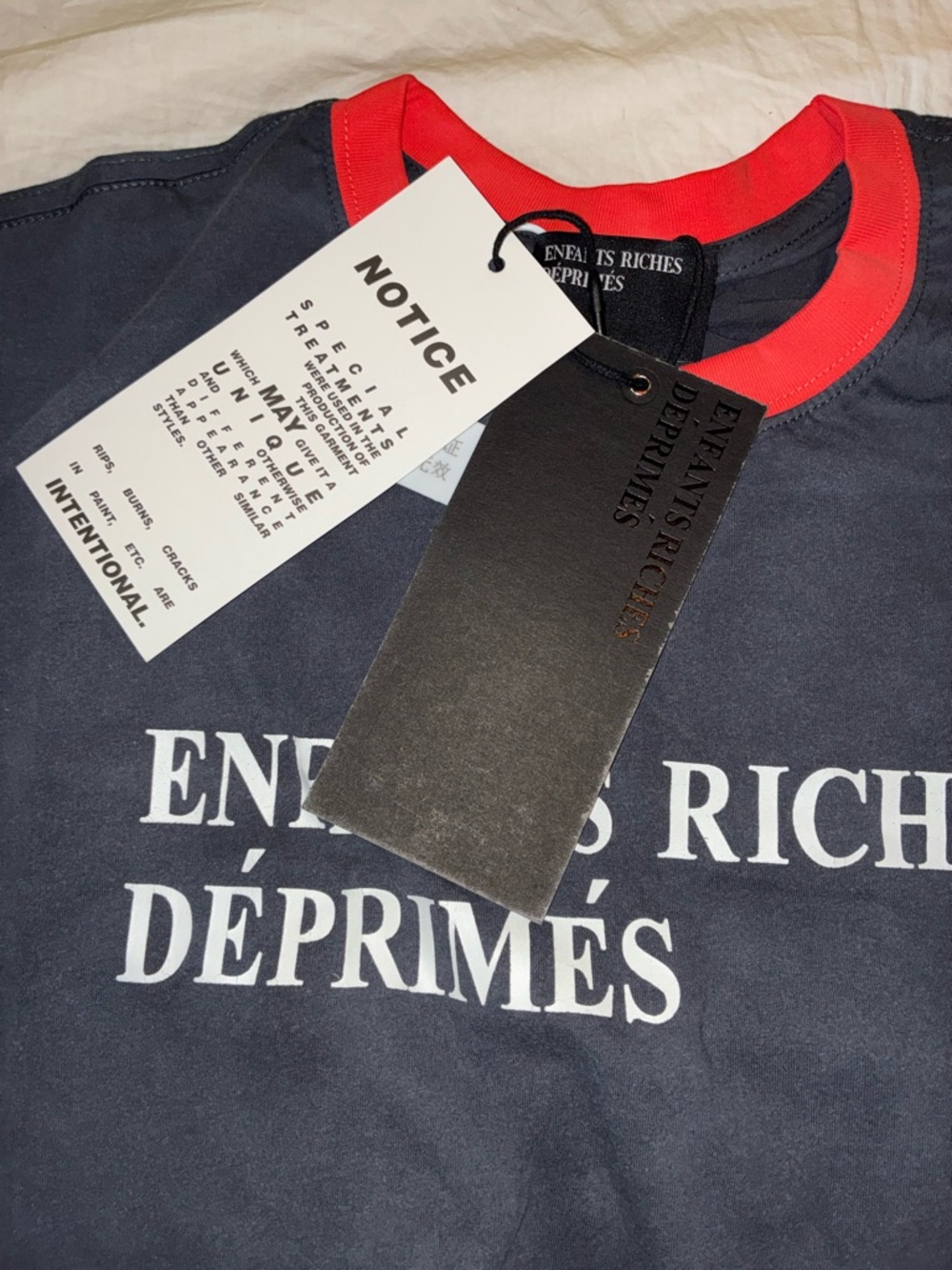 Graphic Tee with White Text and Red Trim
